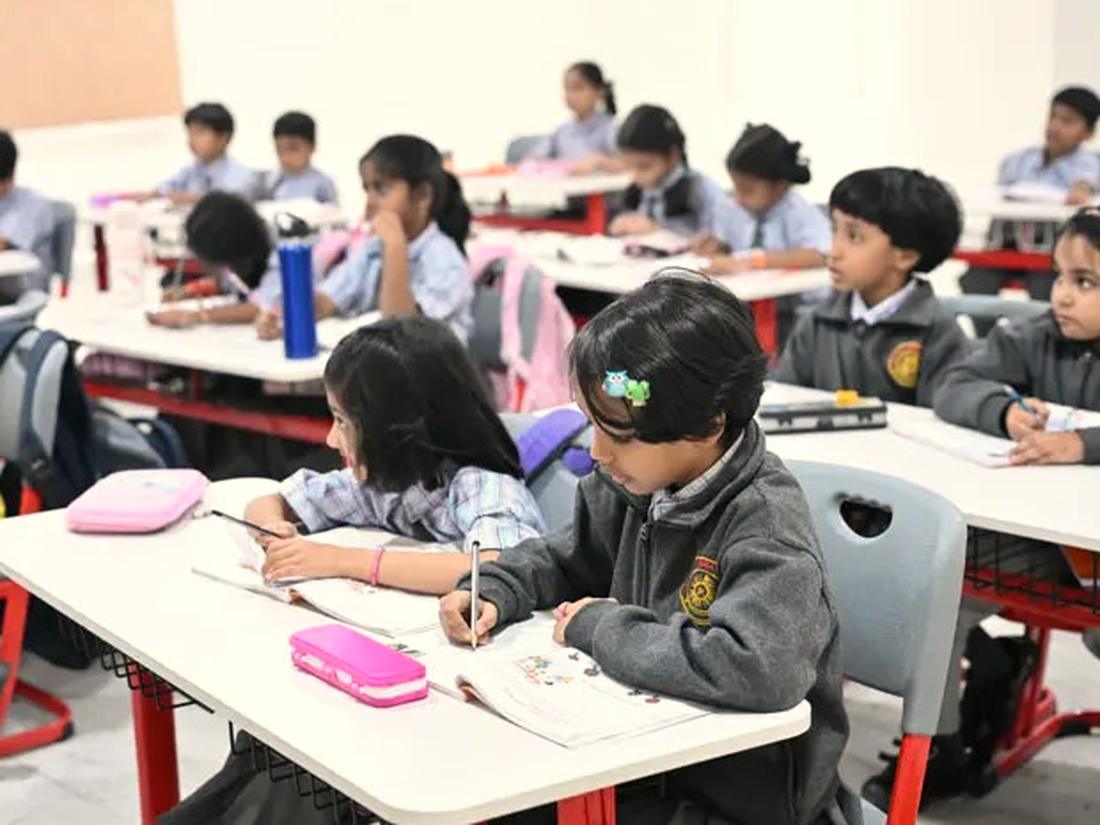 Primary students working at their desks in an Arkaas classroom