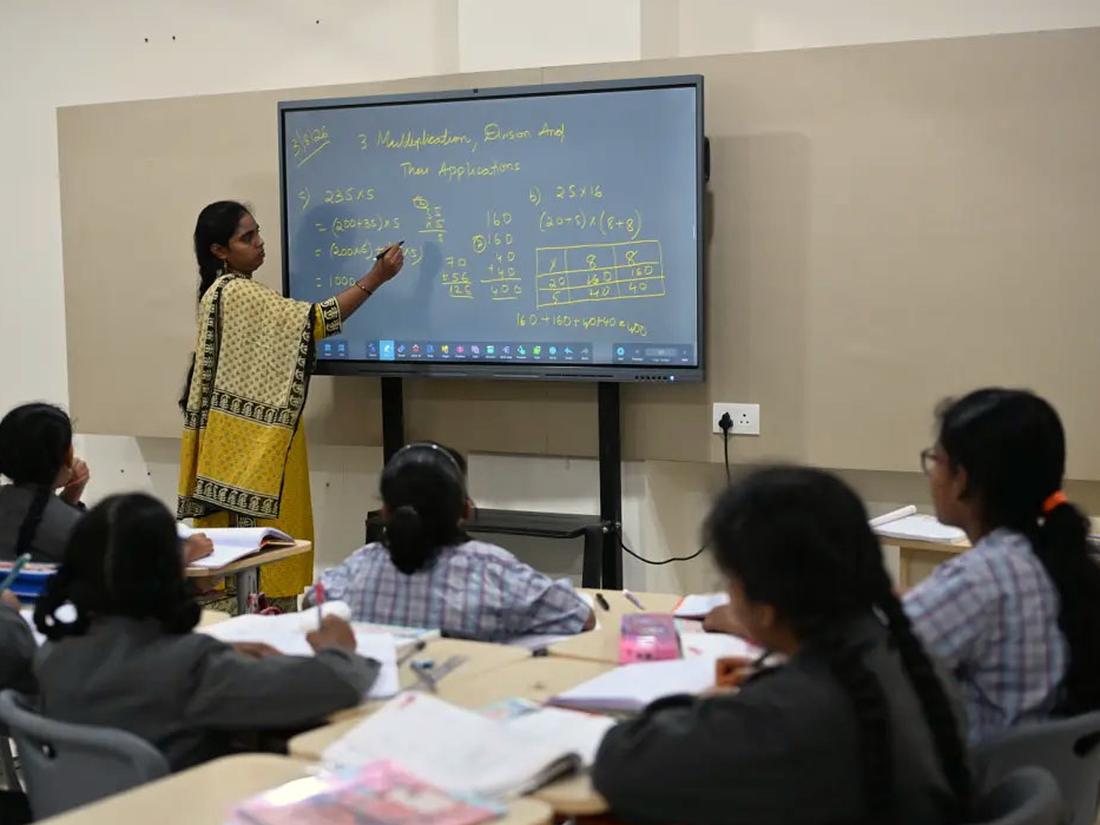 Middle School Middle school students following a lesson on the smart board