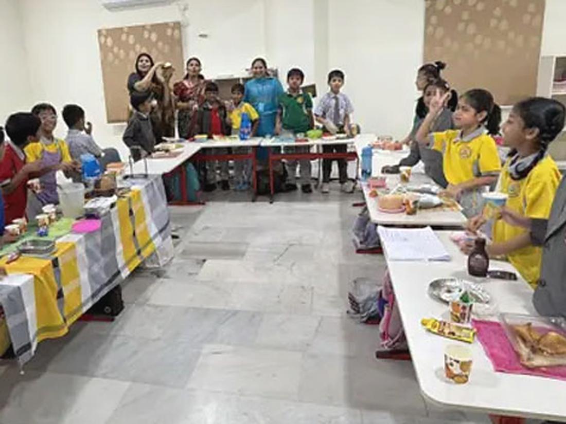 Students working together on a club activity around a table