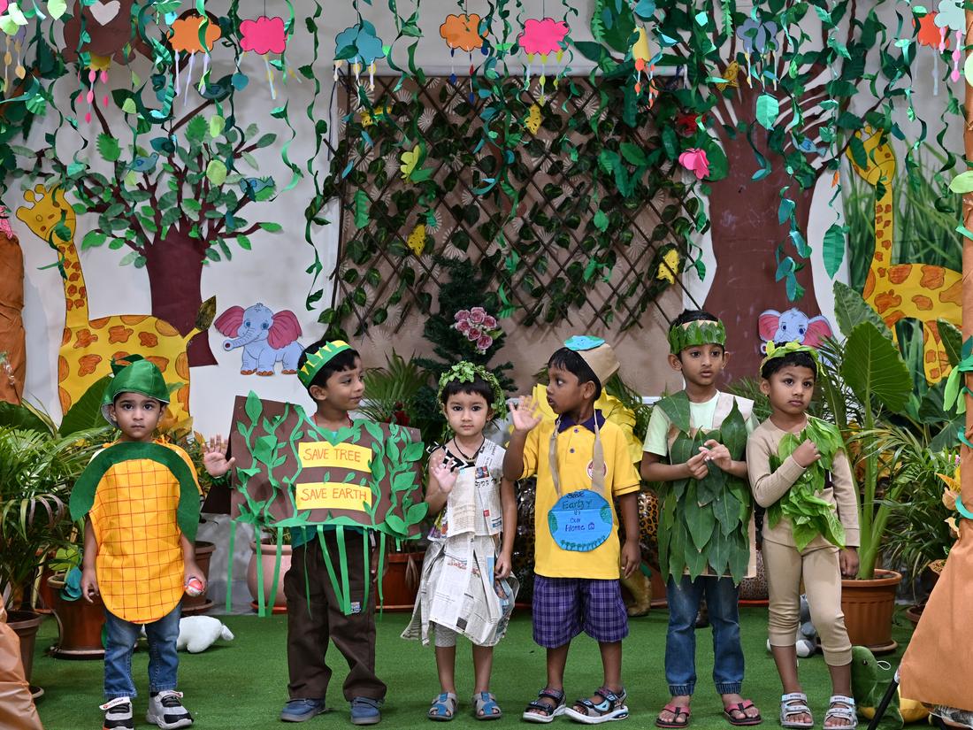 Primary children taking part in a nature celebration