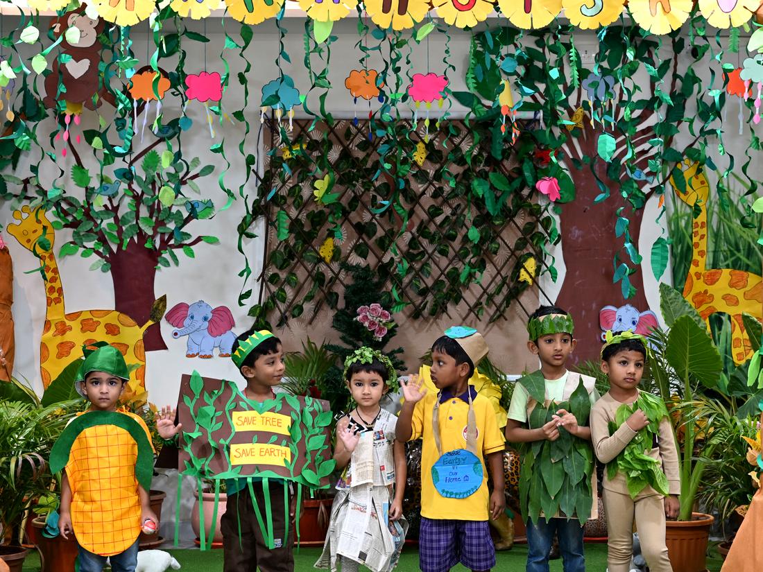 Children in nature-themed costumes celebrating Vanamahotsav at school