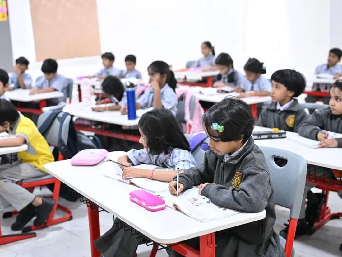 Primary classroom with desks and learning displays