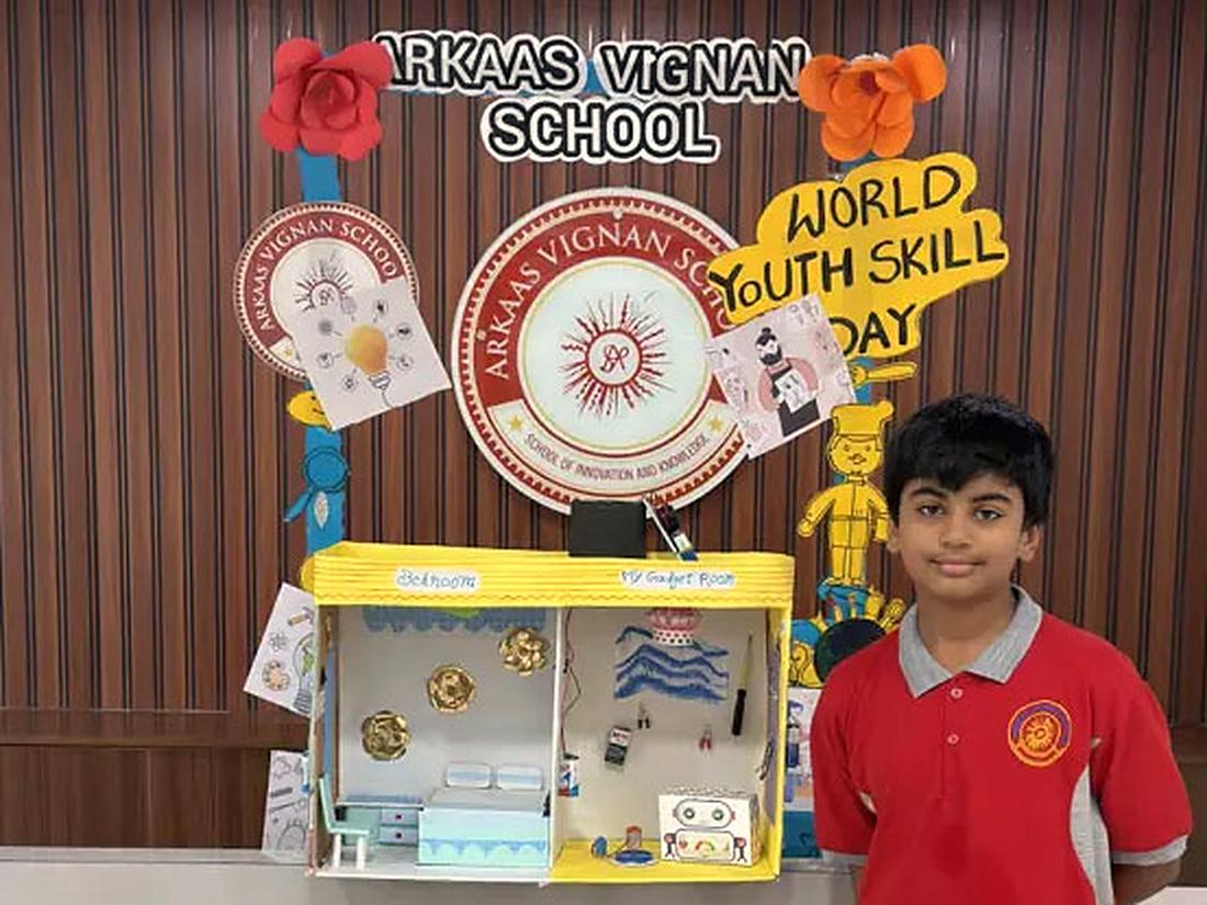 Students presenting their work Student presenting a handmade project to visitors at a school exhibition