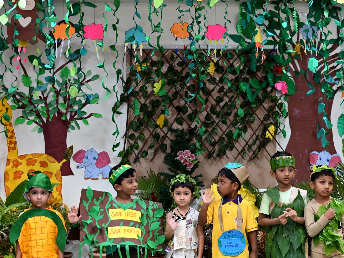 Young children in costumes at a school celebration Young children in costumes at a school celebration